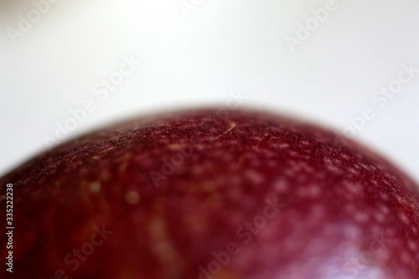 Fototapeta Taking a close-up shot of the skin of a passion fruit looks like an unknown mysterious planet in the universe