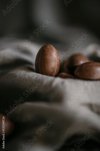 Fototapeta Chocolate Easter eggs on a gray background