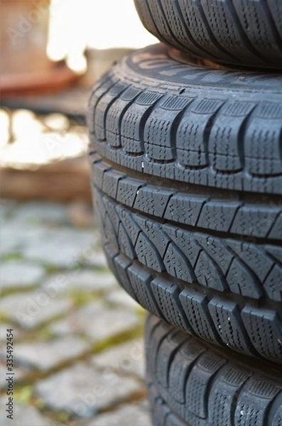 Obraz old winter tyres in portrait format