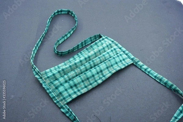 Obraz green mouth mask to cover mouth and nose so that dirty air does not enter the body. One way to prevent the transmission of Corona Covid-19 Virus is by using this tool.
