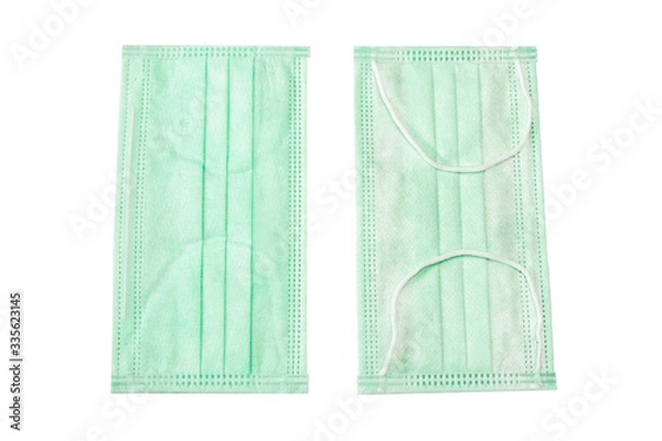 Fototapeta Green mask placed on a white background buried in the Clipping Path.
