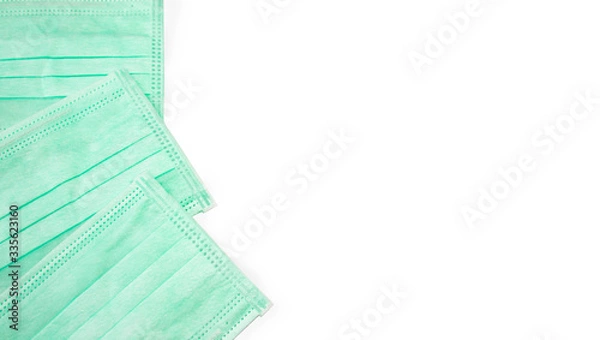 Fototapeta Green mask placed on a white background buried in the Clipping Path.