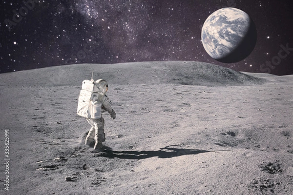 Fototapeta Astronaut on rock surface with space background. Elements of this image furnished by NASA