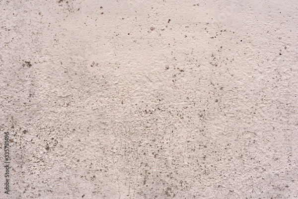 Fototapeta Texture of a concrete wall with cracks and scratches which can be used as a background