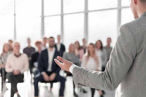 Obraz image of a speaker giving a lecture at a business seminar