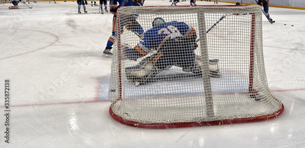 Fototapeta hockey sport, game on ice., coaching the goalkeeper.