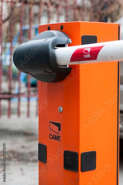 Fototapeta Security system for building access - barrier gate stop with toll booth, traffic cones and cctv