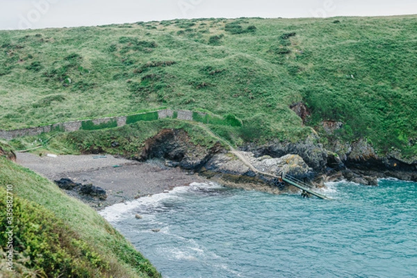 Fototapeta Afternoon view over Dale Princess port starting point in St. Brides Bay from the coastal path in Martin's Haven in Pembrokeshire, West Wales.