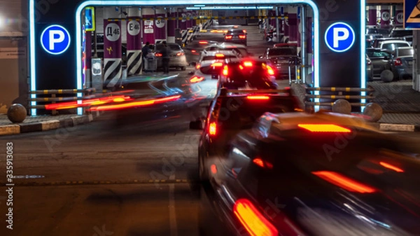 Obraz cars in queue at entrance in underground parking of hypermarket