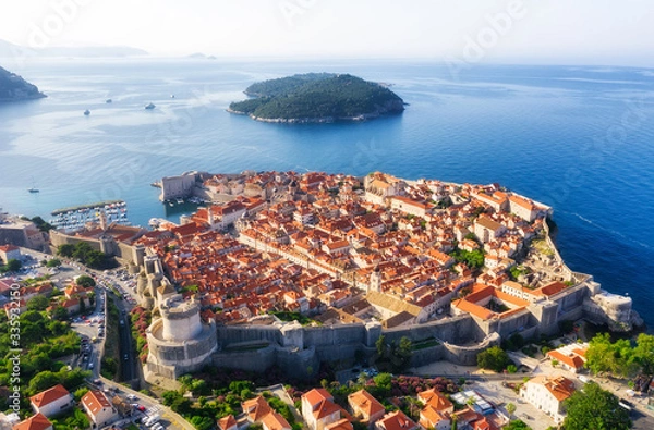 Fototapeta Dudrovnik, Croatia. Aerial view on the old town. Vacation and adventure. Town and sea. Top view from drone at on the old castle and azure sea. Travel - image