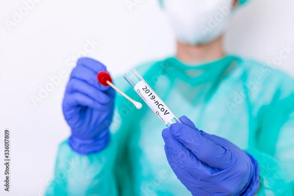 Fototapeta Corona virus Covid-19 respiratory sputum specimen swab test tube with gloves, mask and biohazard bag. Coronavirus or COVID-19 concept. COVID-19 Diagnostic Test. Diagnostic testing for COVID-19.