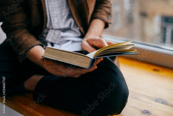 Obraz Young man reading a book