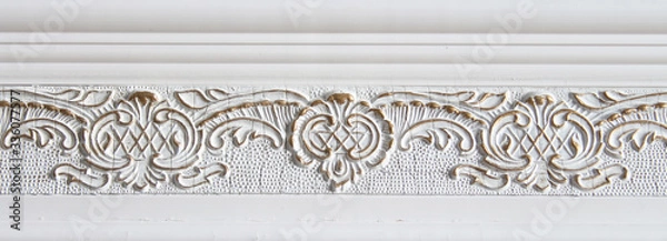 Fototapeta molding on the wall frieze on the wall, a bas-relief, wall decoration, background modeling.