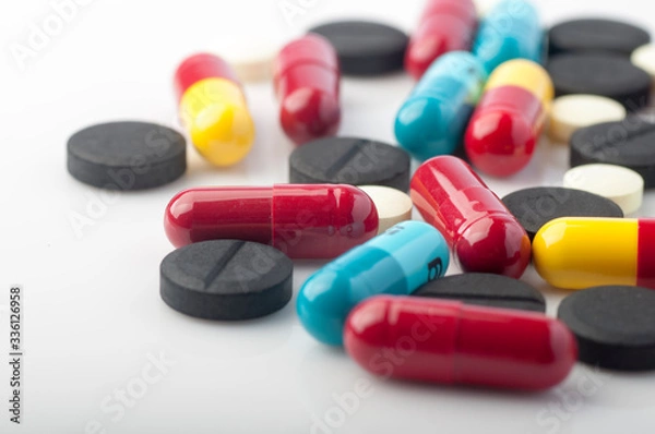 Obraz colorful pills on white