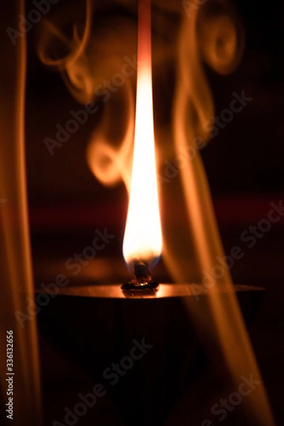 Fototapeta flame and fumes of smoke streak creating a curtain effect