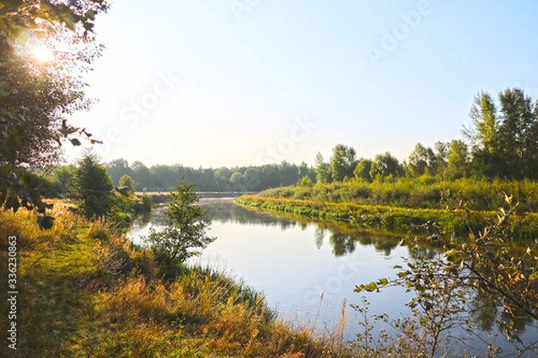Obraz Dawn on the bank of a winding river.