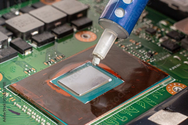 Fototapeta Thermal grease on a processor on a computer motherboard