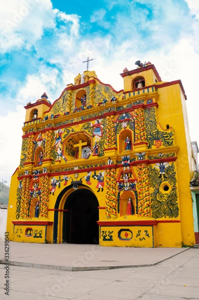 Obraz The picturesque church of El Calvario is located in San Andres Xecul, Totonicapan Guatemala.Built on the XVII century its architecture and details of the facade represent saints, animals, fruits
