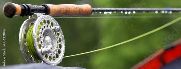 Fototapeta Fragment of a fly fishing rod with dew drops