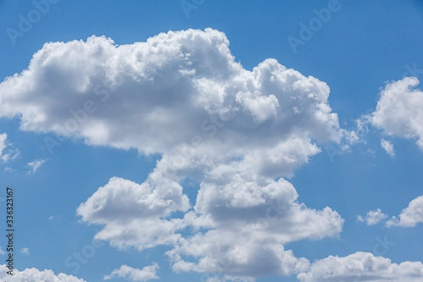Obraz Blue sky with white curly clouds