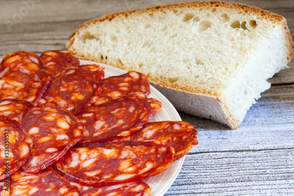 Obraz typical Spanish chorizo sausage and rustic  bread  close-up