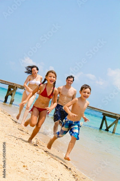 Obraz Family running on the beach