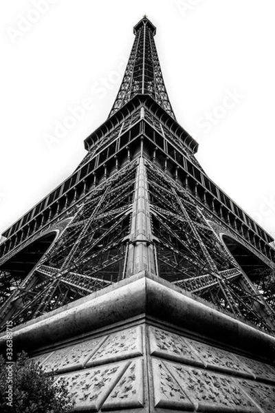 Fototapeta Eifel tower from a corner below, black and white