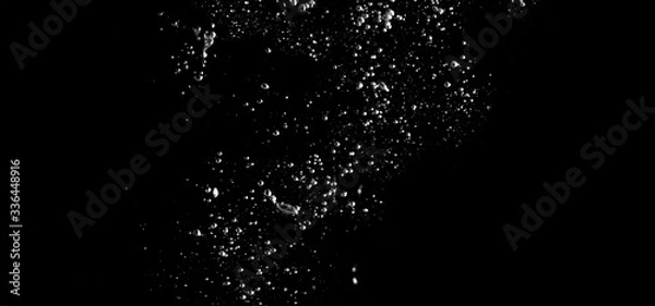 Obraz Blurry images of real soda bubbles floating and splashing up in black background which represent freshness of carbornate drink or sparkling water and shoot from realistic water moving not 3D making