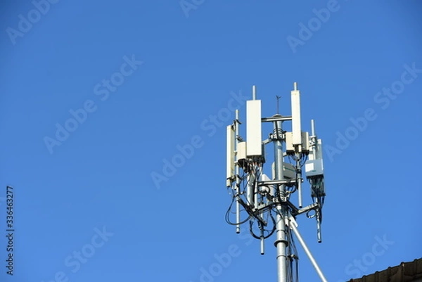 Fototapeta Telecommunication tower with antennas.High pole for signal transmission. There are both wireless phone systems and microwave systems.	
