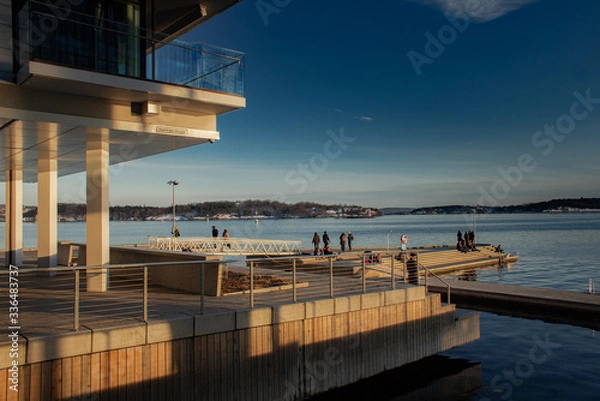 Fototapeta Oslo, Norway in early spring with clear skies and buildings