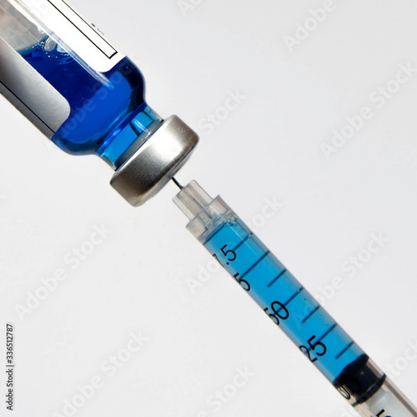 Fototapeta Close-up of a syringe and a vial of injectable solution