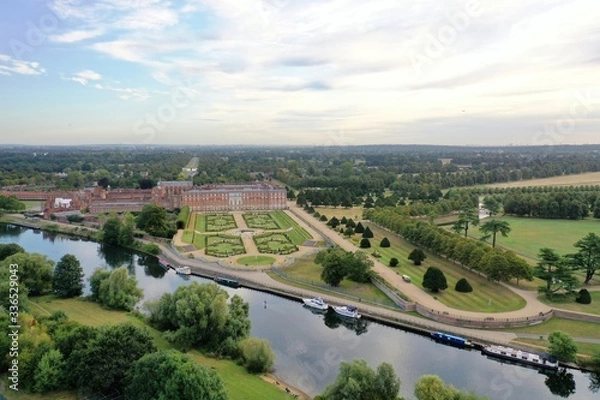 Fototapeta Scenic View of Hampton Court Palace with Beautiful Gardens and the City Behind