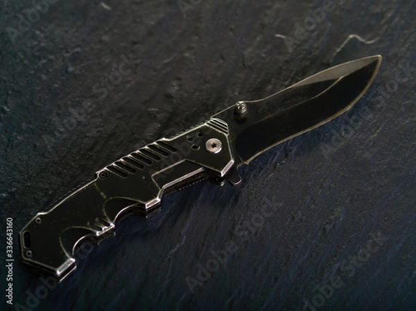 Fototapeta Knife sharpening with whetstone sharpener