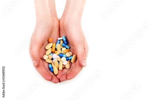 Obraz Hand getting pills, tablets, vitamins, drugs, capsules isolated on white background. Health care concept. Pharmacy.