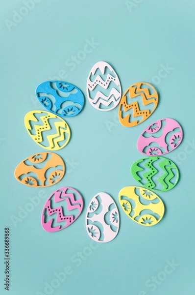 Fototapeta Easter background. Paper easter eggs. Greeting card for the holiday. Multicolored details, bright pastel frame background. A lot of elements.