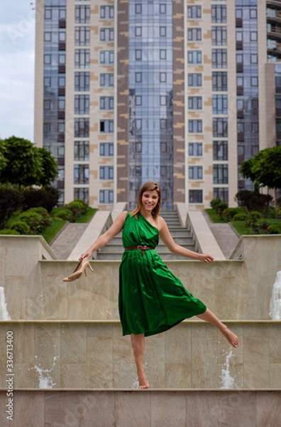 Obraz smiling girl walking in the city