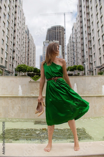 Obraz smiling girl walking in the city