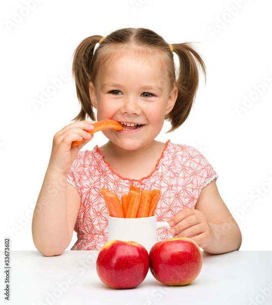 Obraz Cute little girl eats carrot and apples