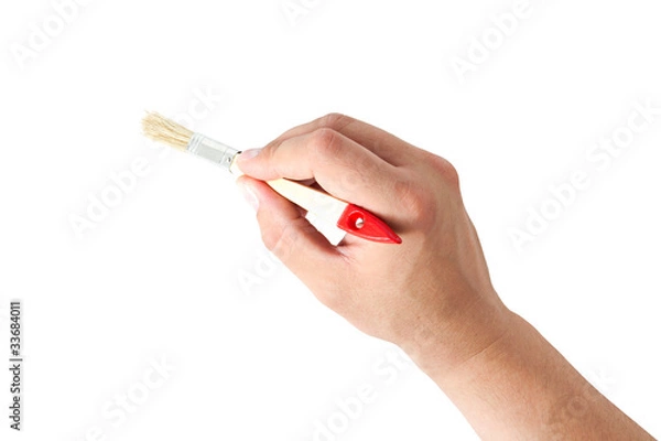 Obraz hand holding a brush