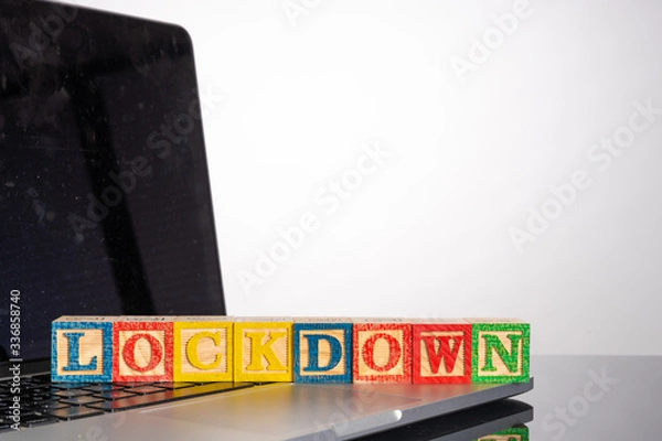 Fototapeta Lockdown letter in wooden cube with healty concept.