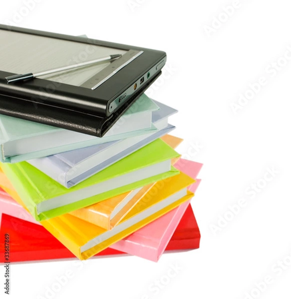 Fototapeta Stack of colorful books and electronic book reader