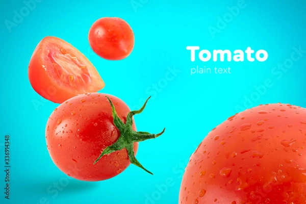 Obraz Fresh flying tomatoes on a blue background with drops. Tomatoes with full depth of coldness