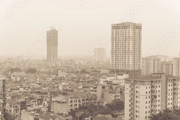 Fototapeta Filtered image top view foggy and misty Hanoi urban landscape causes by air pollution