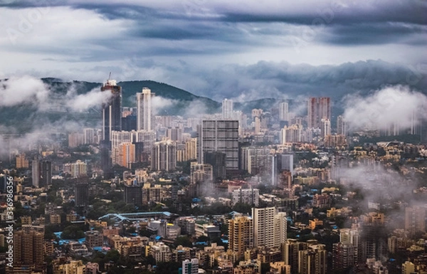 Fototapeta Mumbai seen through the clouds on a rainy monsoon day.