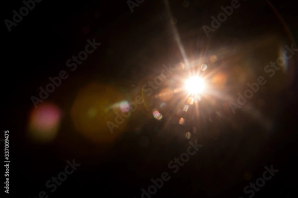 Obraz Abstract Natural Sun flare on the black background.