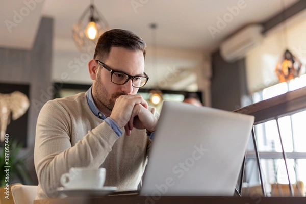 Fototapeta Businessman working on a laptop computer