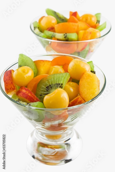 Fototapeta Delicious mix of different summer fruits salad