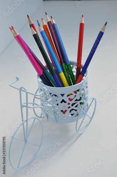 Fototapeta colored pencils in a basket