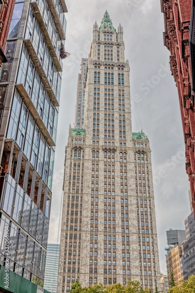 Fototapeta The Woolworth Building 1913 neo-Gothic skyscraper a famous architectural landmark during the gloomy weather shot from Park Row street, New York.