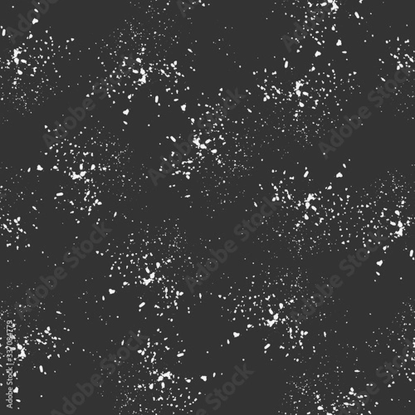 Fototapeta Seamless pattern, white dots randomly scattered on a dark background. Spray texture. Vector.